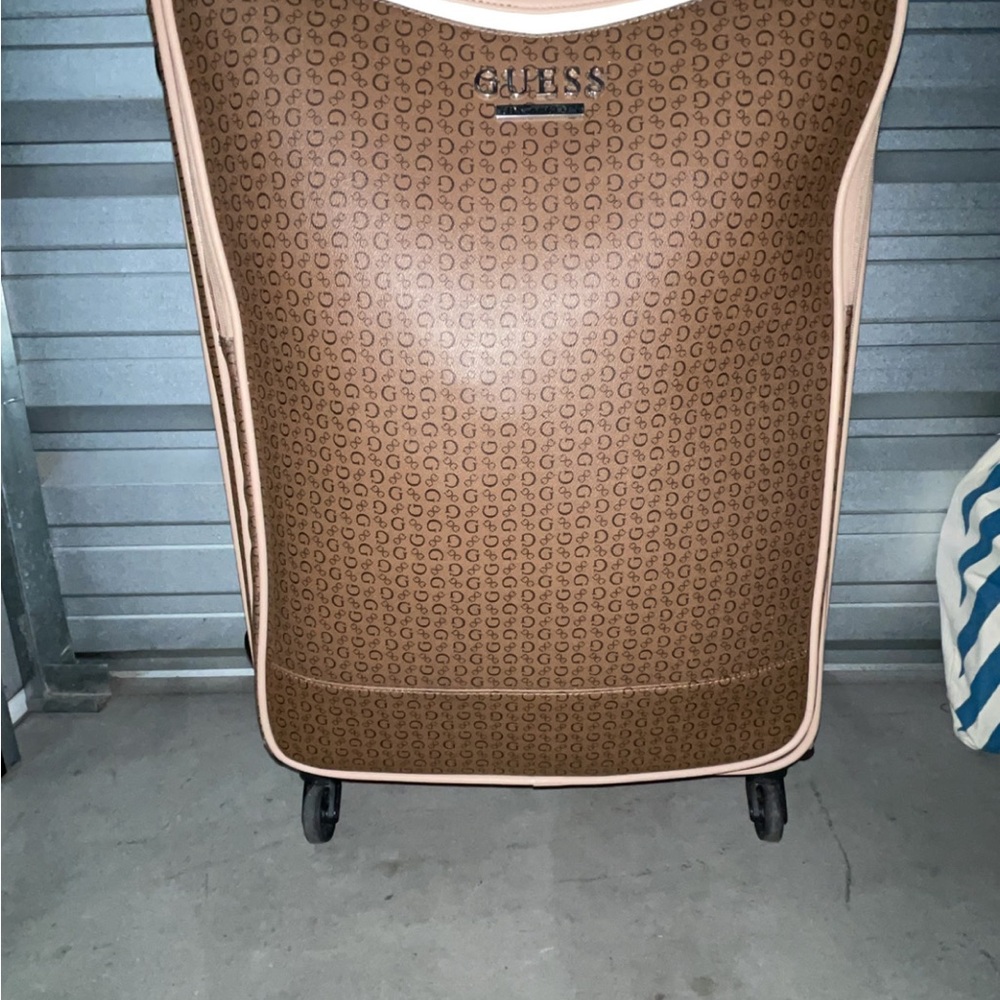 Guess brown monogram rolling suitcase with beige trim